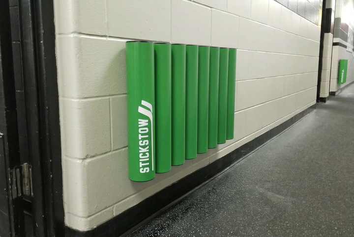 Green eight-tube hockey stick rack