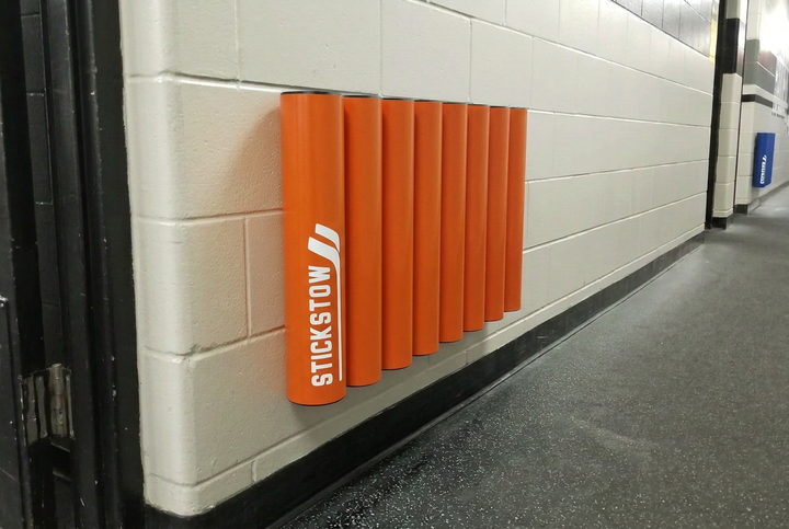 Orange eight-tube hockey stick rack