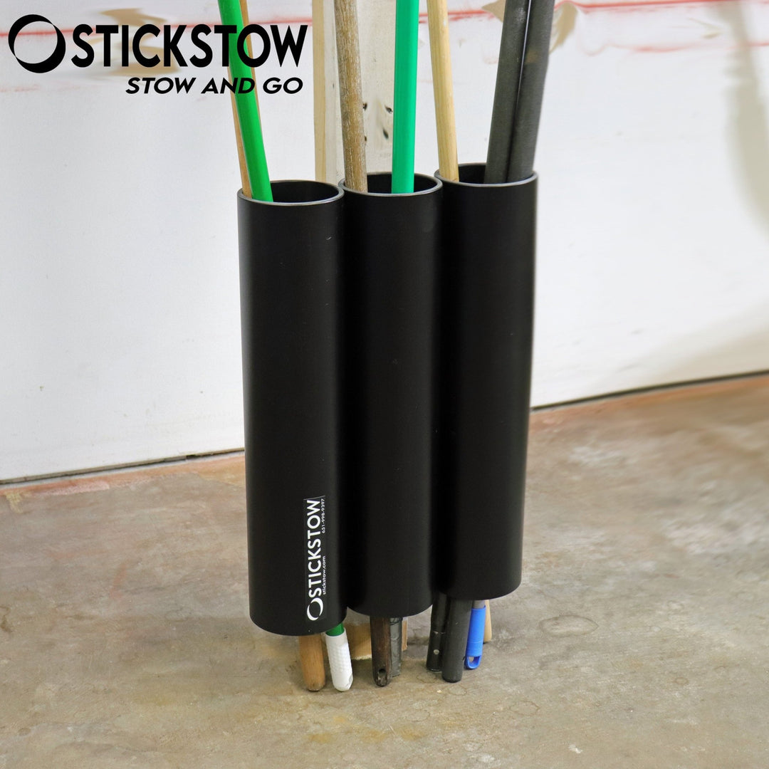 Stickstow closet wall mount holder of brooms rakes mops and more - Stickstow